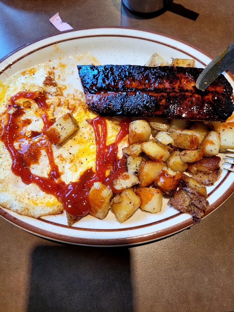 Breakfast plates on a cozy restaurant table.